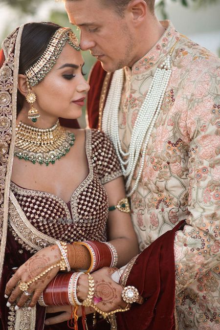 Photo of Wedding day couple shot in contrasting outfits