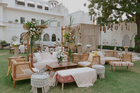 Photo of Rustic chic decor elements with rattan chairs and pampas grass decor for a pre-wedding event