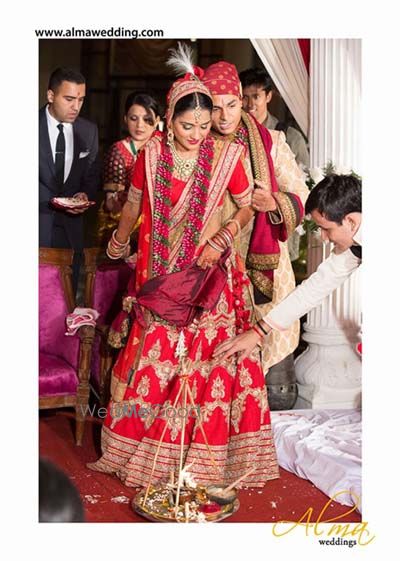 Photo of red and gold sabyasachi lehenga