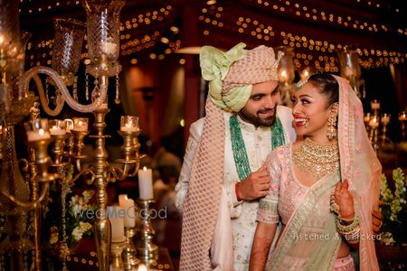 Photo of coordinated pastel bride and groom with matching decor