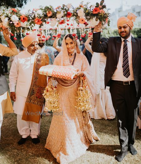 Photo of Bridal entry under phoolon ki chaadar