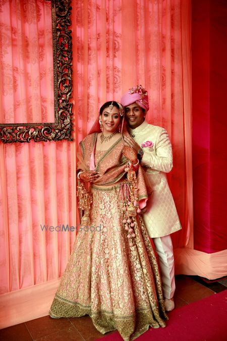 Photo of light pink and gold lehenga