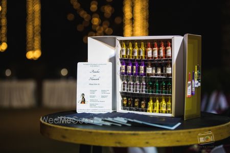 Photo of Mini bar fridge decor with small bottles favours