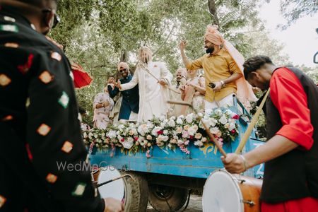 Photo of fun sikh groom entry on truck