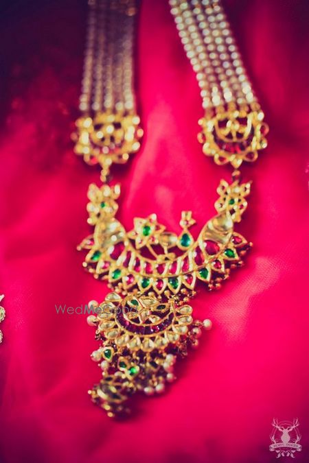 Photo of kundan gold and emerald tukdi with strings