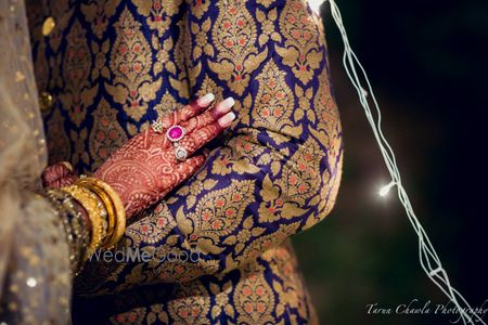 Photo of blue sherwani. blue brocade fabric