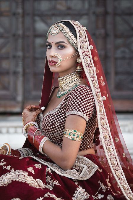 Photo of Sabyasachi bride in maroon lehenga