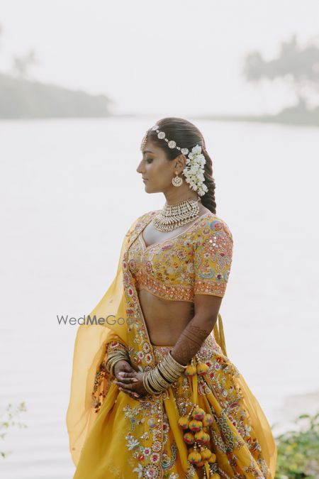 Photo of mustard-hued mehendi lehenga design