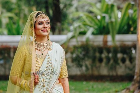 Photo of Bride wearing satlada with offbeat lehenga