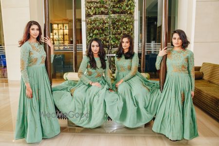 Photo of Coordinated bridesmaids in green anarkalis