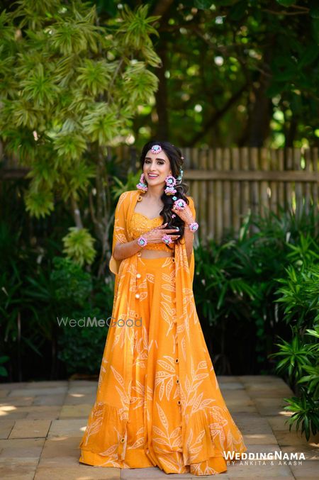 Photo of Breezy bridal Haldi look in yellow co-ords with a jacket and floral jewellery