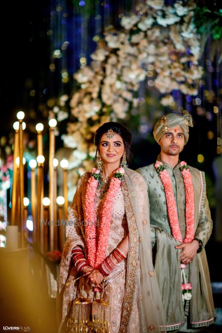 Photo of Bride and groom posing on their wedding day.