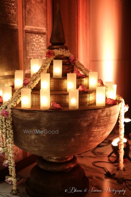 Photo of Bronze copper pot with candles