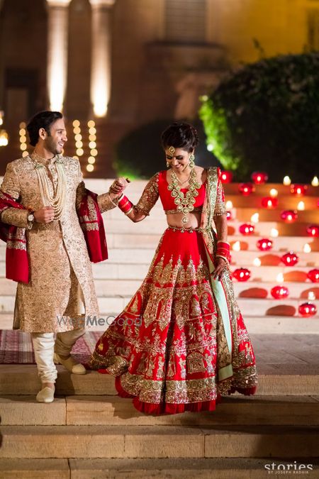 Photo of Red manish malhotra bridal lehenga