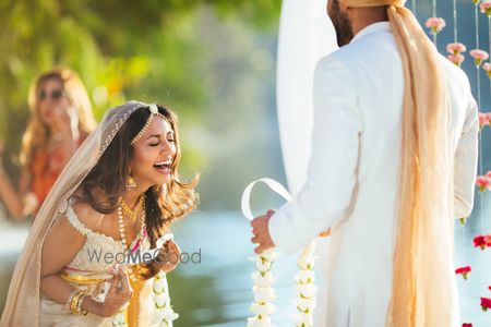 Photo of Bright and happy couple jaimala shot