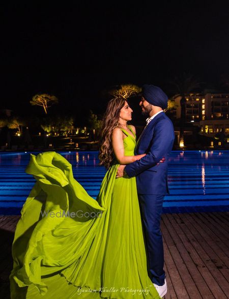 Photo of Green flowing gown engagement photo