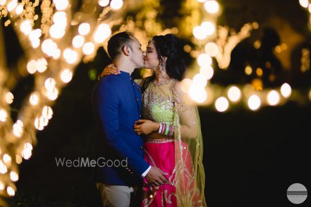 Photo of Romantic couple kissing shot with fairy lights