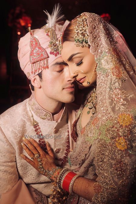 Photo of Serene couple shot with the bride in a pastel lehenga and groom in pink safa