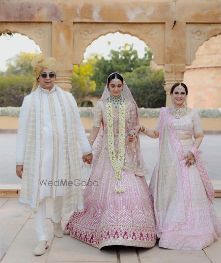 Photo of kiara advani wedding bridal entry portrait with mom and dad