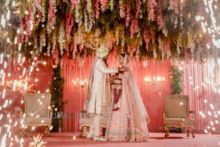 Photo of unique jaimala stage decor with couple and fireworks