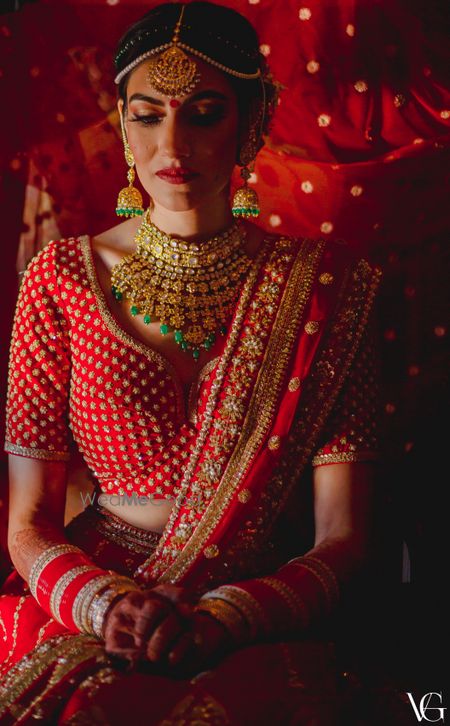 Photo of Bridal portrait with a choli cut blouse and sabyasachi lehenga