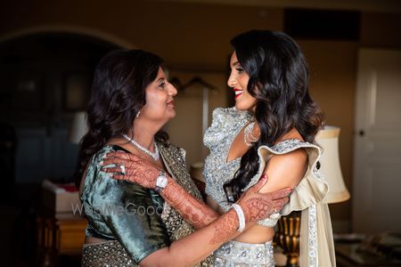 Photo of cute shot of bride with her mother on her sangeet