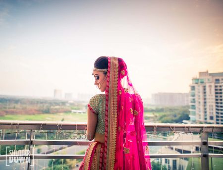 Photo of Pretty bridal portrait with bride looking back