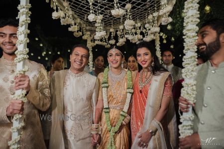 Photo of pretty south indian bride and bridal entry