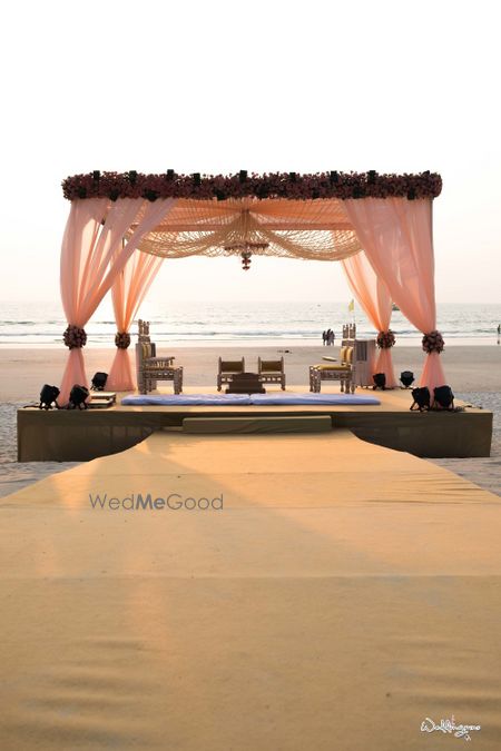 Photo of Beach mandap idea in pastel pink