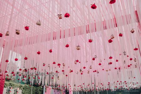 Photo of pretty mehendi decor for tent with pink florals