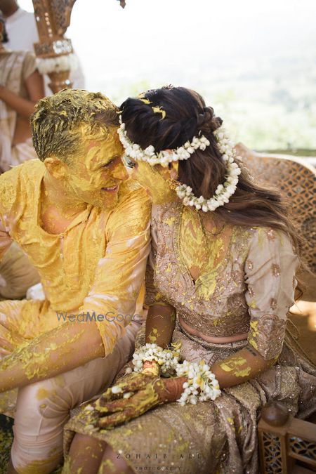 Photo of Bride and groom cute haldi portrait