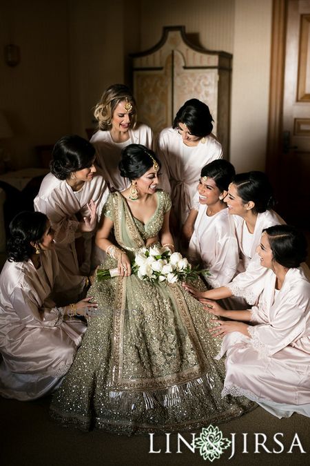 Photo of Cute bride and bridesmaid photo after getting ready