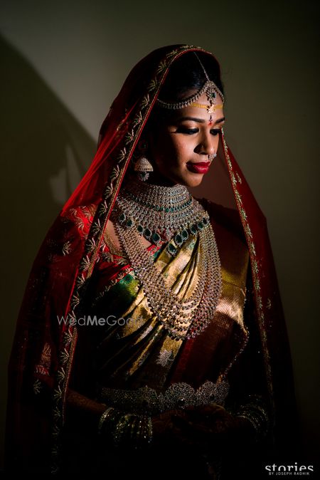 Photo of South Indian bridal portrait with layered diamond jewellery