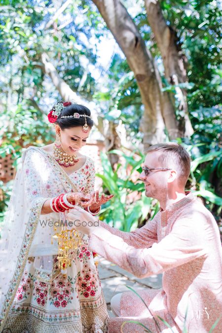 Photo of Bride smiling with her friend wearing kaleeras