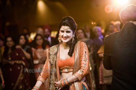 Photo of orange and brown pretty lehenga