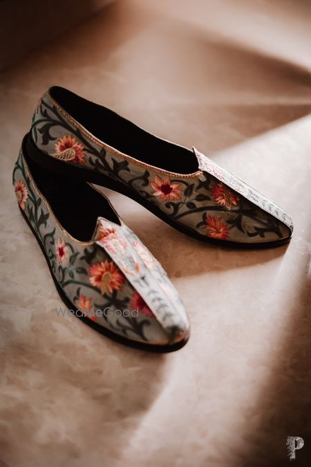 Photo of unique embroidered groom shoes in grey colour