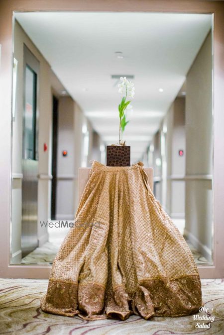 Photo of sabyasachi gold lehenga