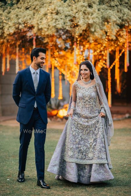 Photo of A candid shot of a bride and groom looking at each other.