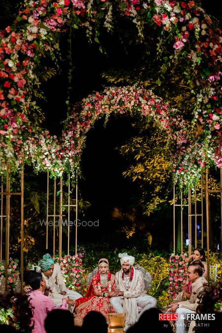 Photo of Phera and pooja shot in an open mandap