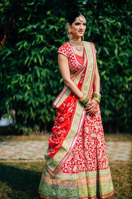 Photo of A beautiful bridal portrait capturing the bridal lehenga