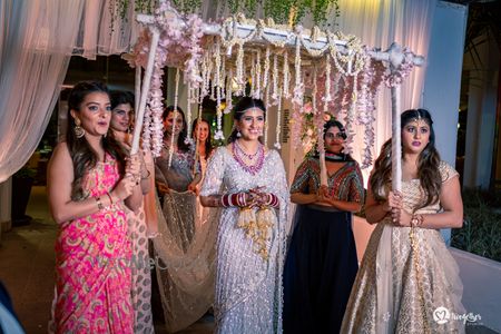 Photo of Bride entering under phoolon ki chadar