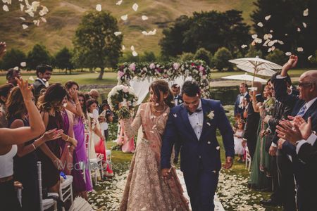 Photo of Petal shower on couple after the wedding