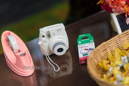 Photo of Polaroid camera on mehendi