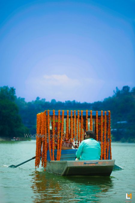 Photo of Bride exiting on a lake