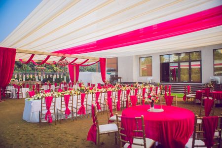 Photo of Bright pink decor themed table setting.