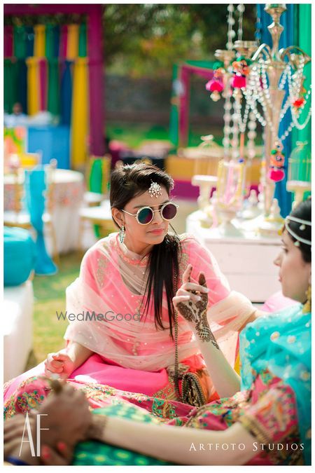 Photo of Neon pink bridesmaid with sunglasses