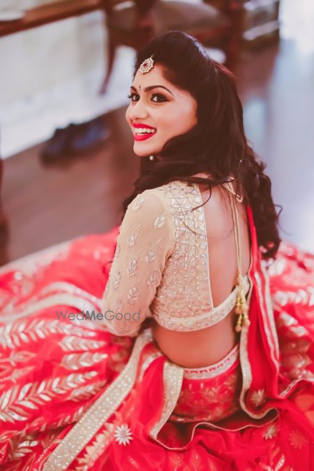 Photo of light gold and red lehenga