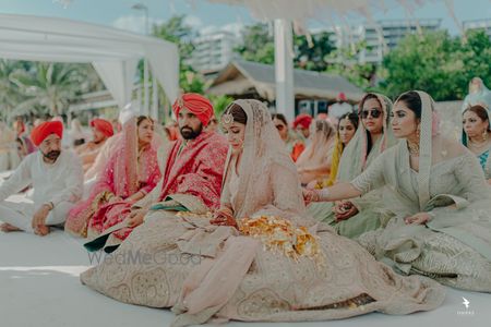 Photo of A shot of the bride and groom during the Anand Karaj