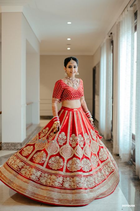 Photo of Twirling bride shot in a Sabyasachi lehenga