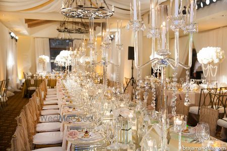 Photo of Gold and white glamorous wedding reception table